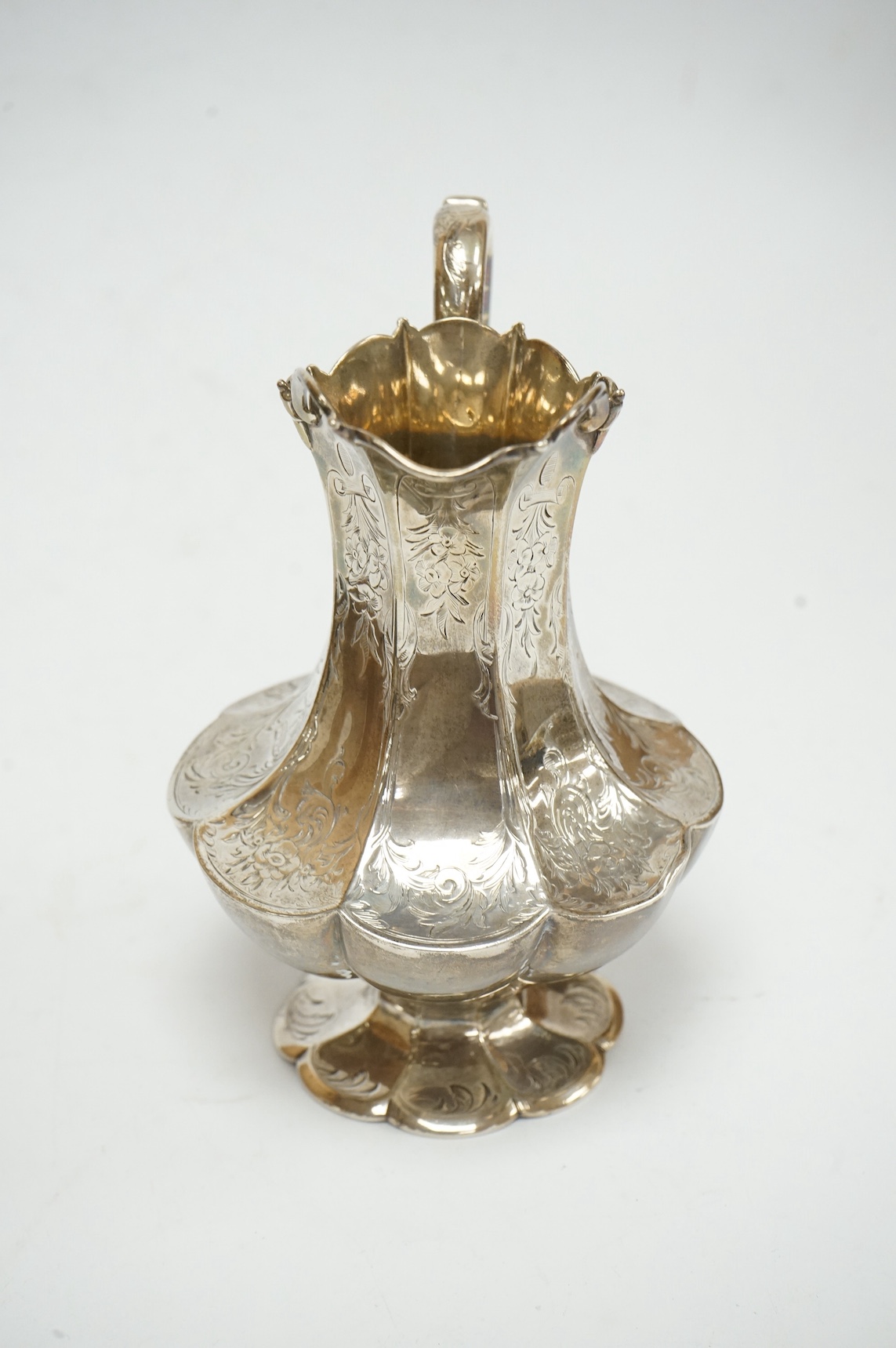 A Victorian engraved silver cream jug, by Hayne & Cater, London, 1855, 15.7cm, 9.3oz. Condition - poor to fair